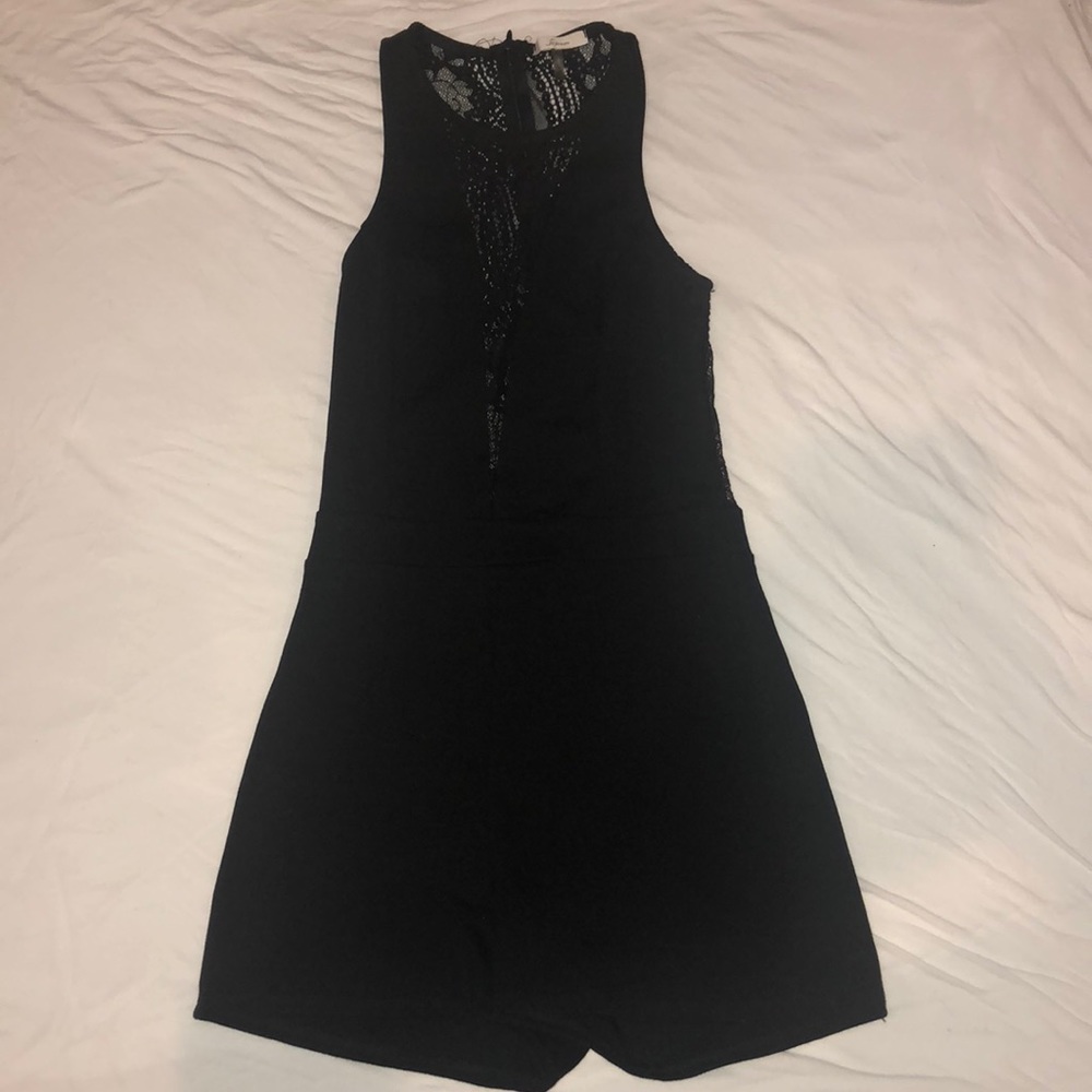 Black xs romper with dip neck lace detailing
